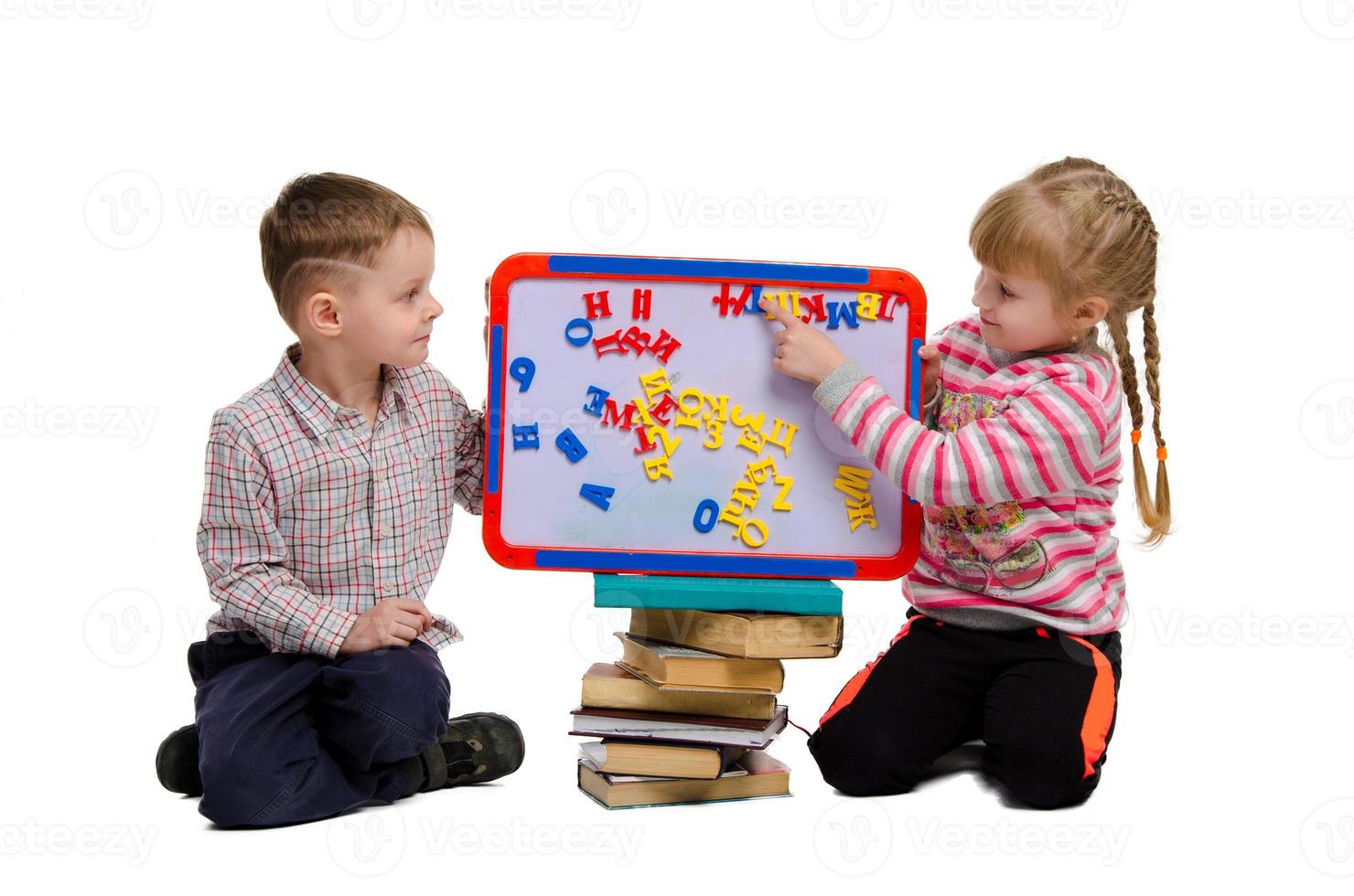 boy and girl learn alphabet photo