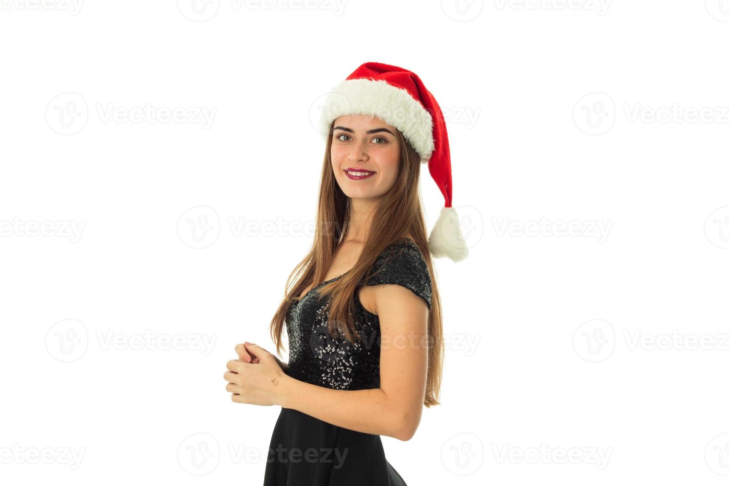 portrait of cheerful cutie girl in santa hat photo