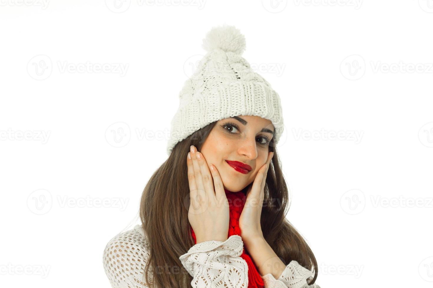 brunette girl in warm sweater and red scarf photo