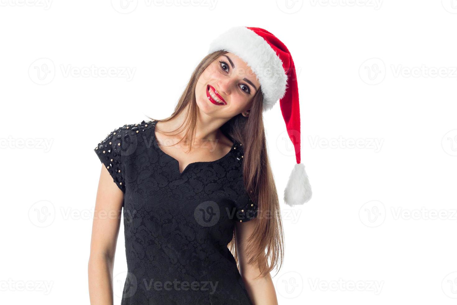 young charming girl in santa hat photo
