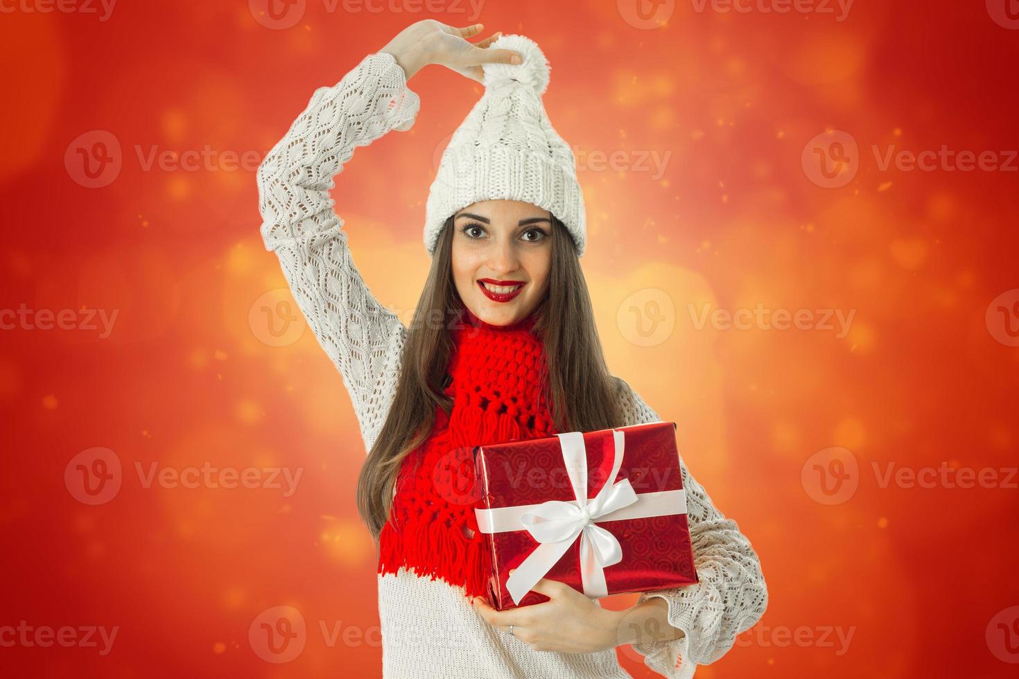 woman in warm sweater and red scarf photo