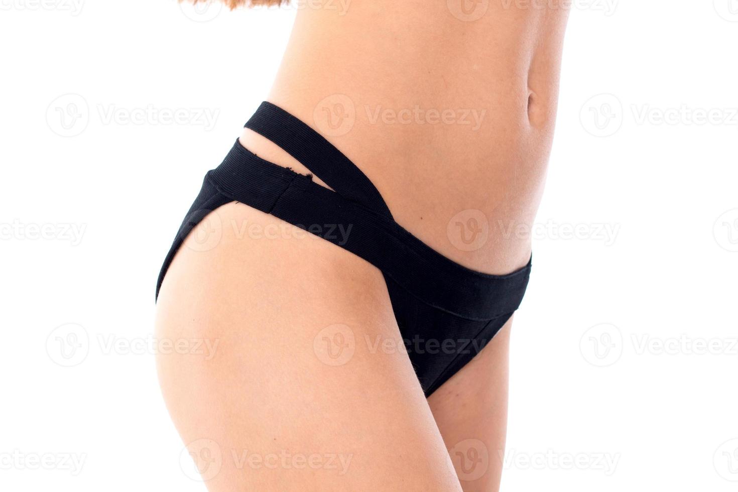 slim woman in black swim panties photo