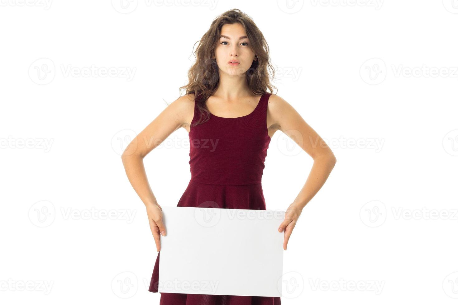 girl in red dress with white placard photo