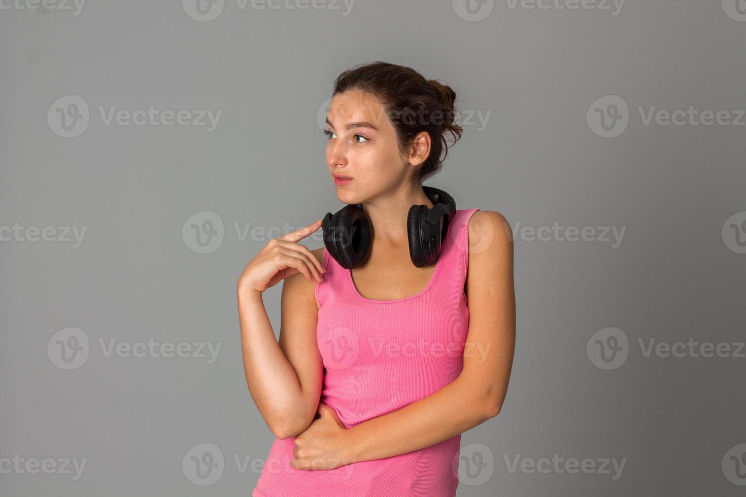 girl with headphones in studio photo