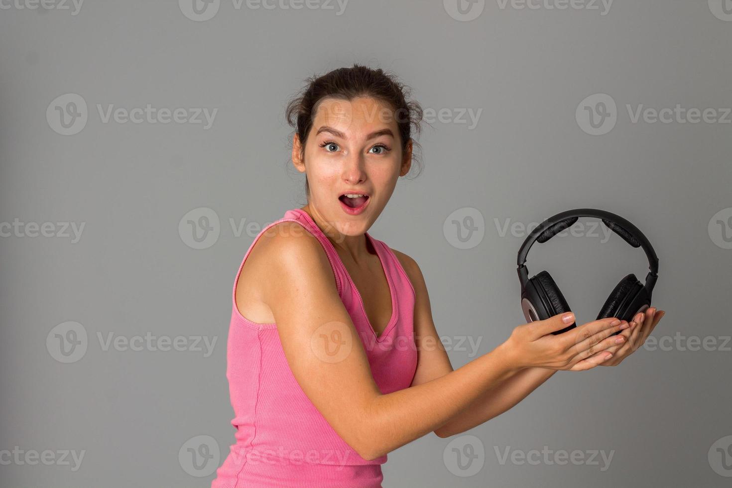 girl with headphones in studio photo