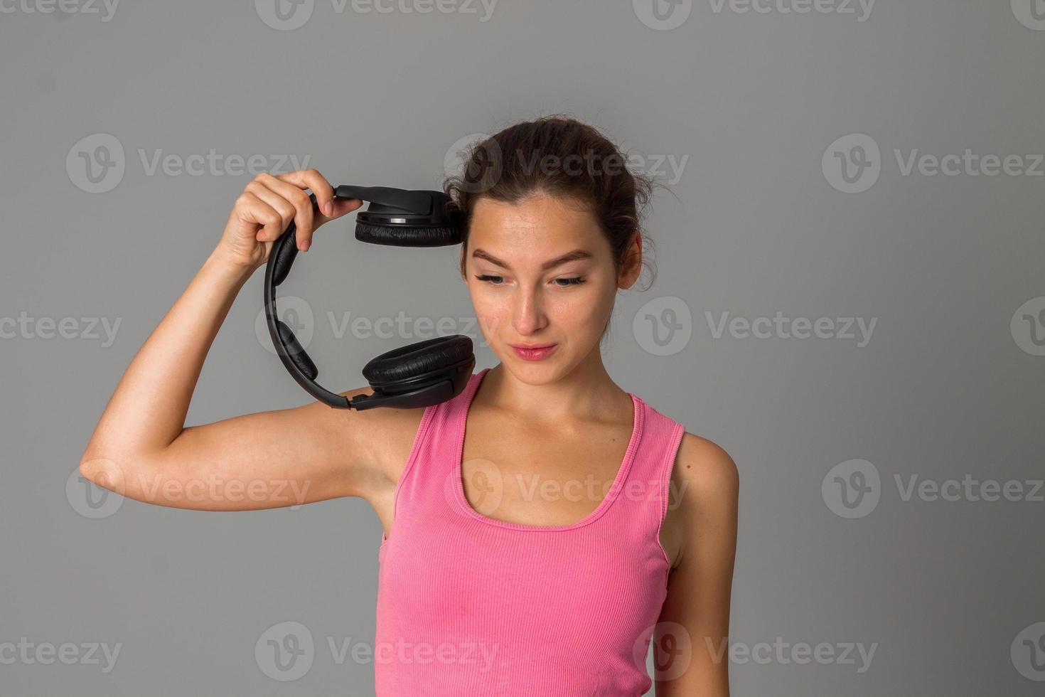 girl with headphones in studio photo