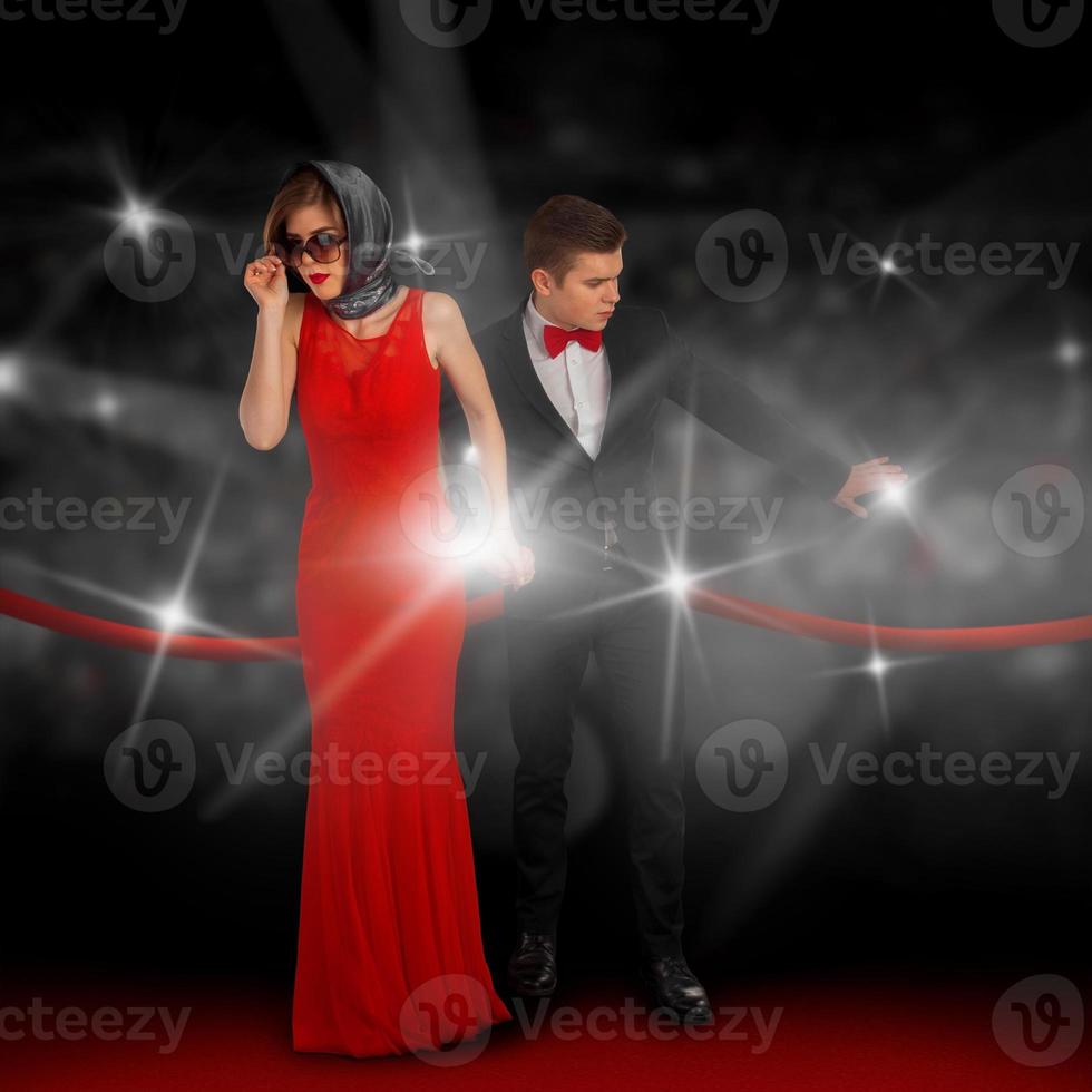 fashionable couple on red carpet photo