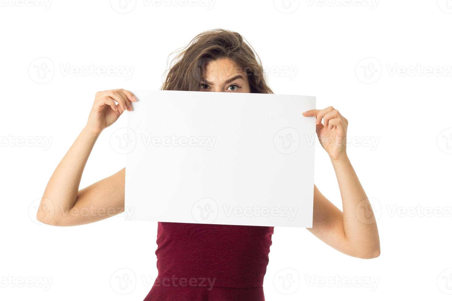 girl in red dress with white placard photo