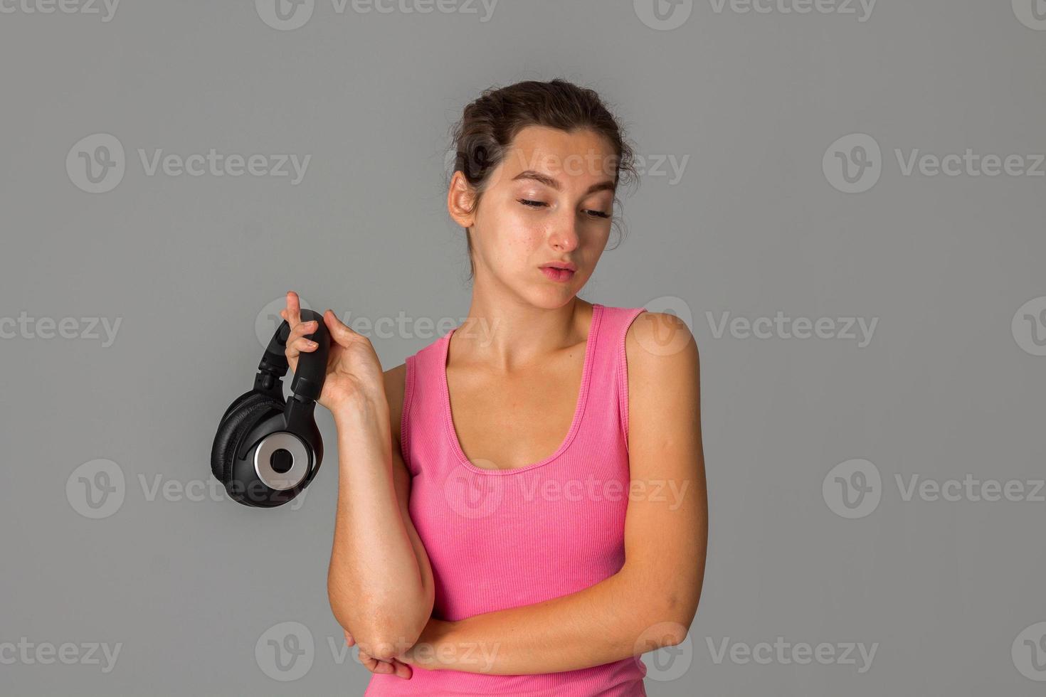 girl with headphones in studio photo