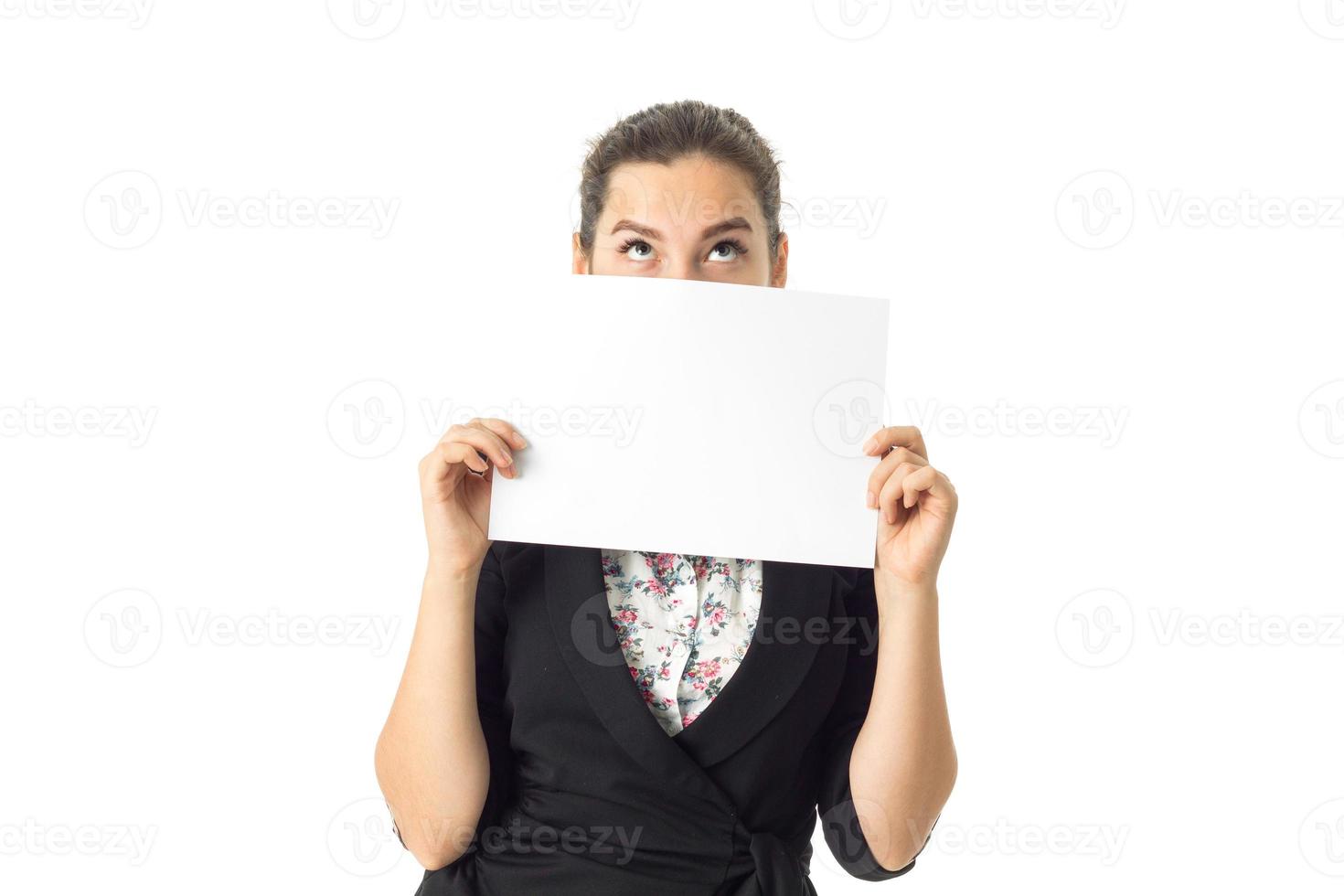 woman in uniform with white placard in hands photo