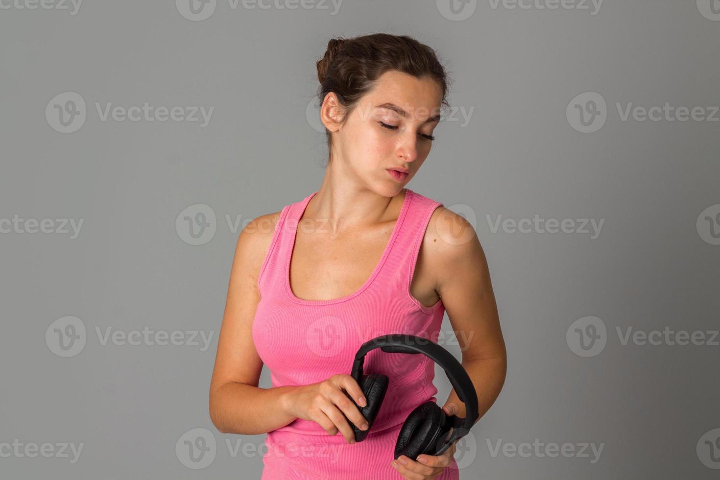 girl with headphones in studio photo