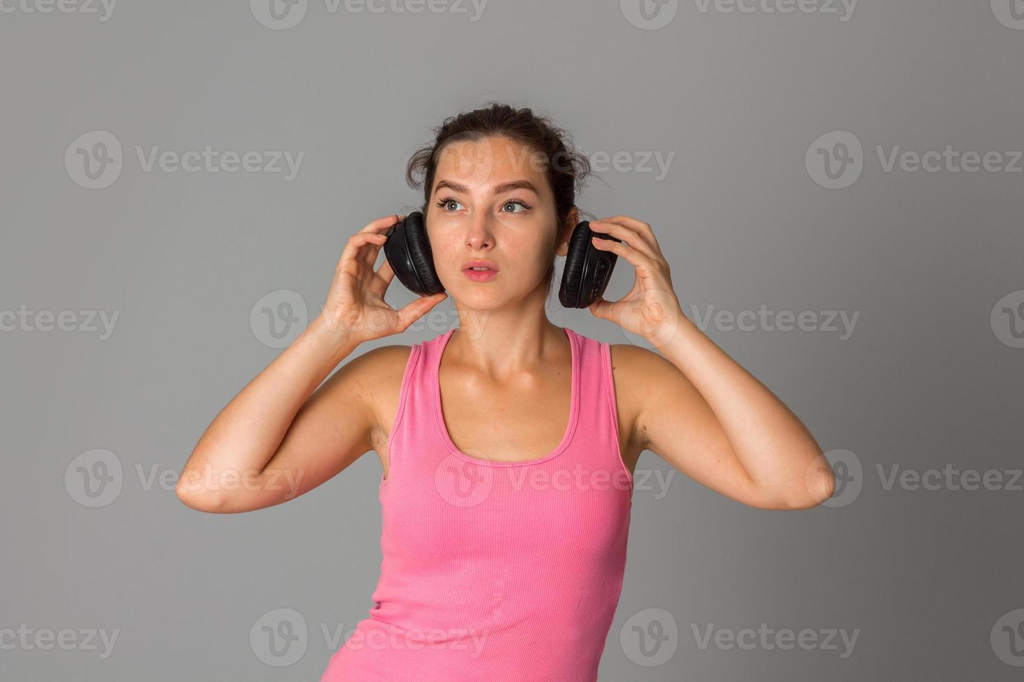 girl with headphones in studio photo