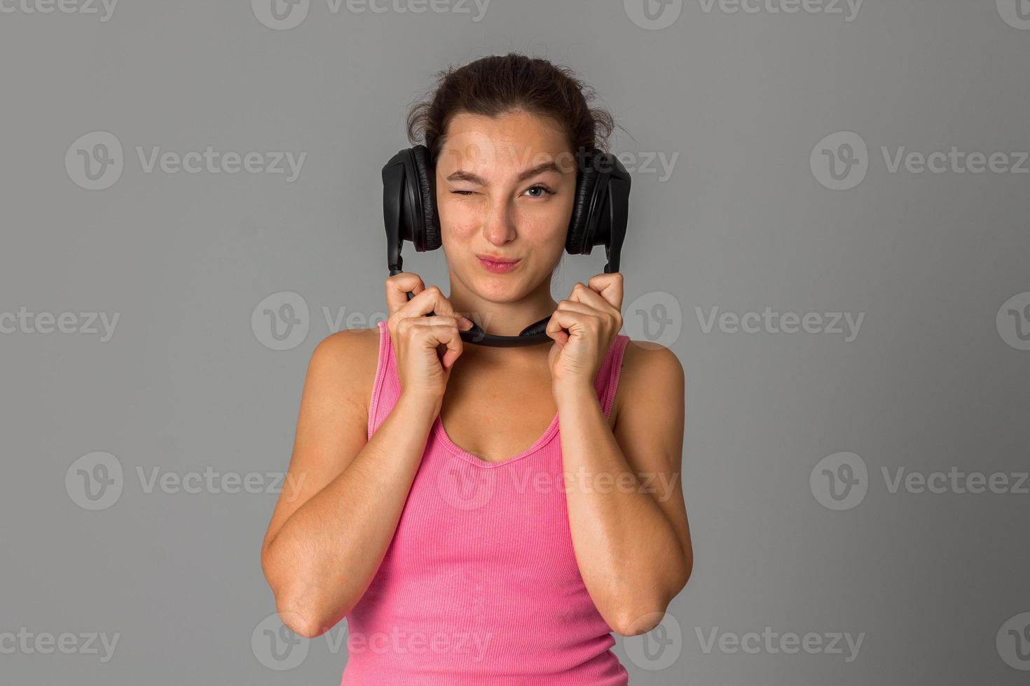 girl with headphones in studio photo