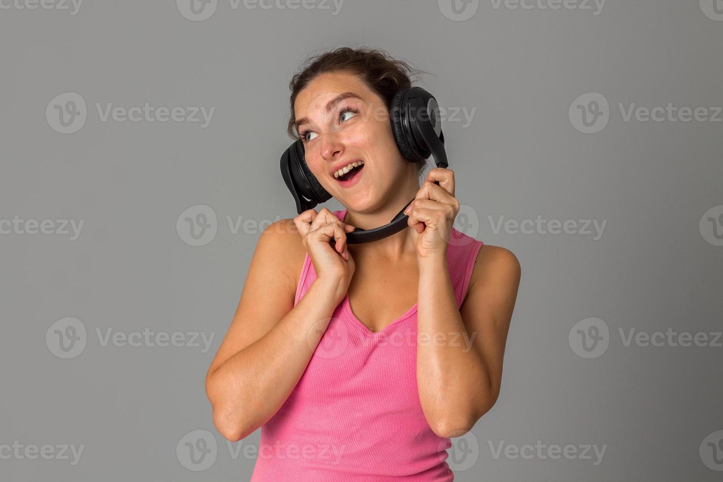 girl with headphones in studio photo