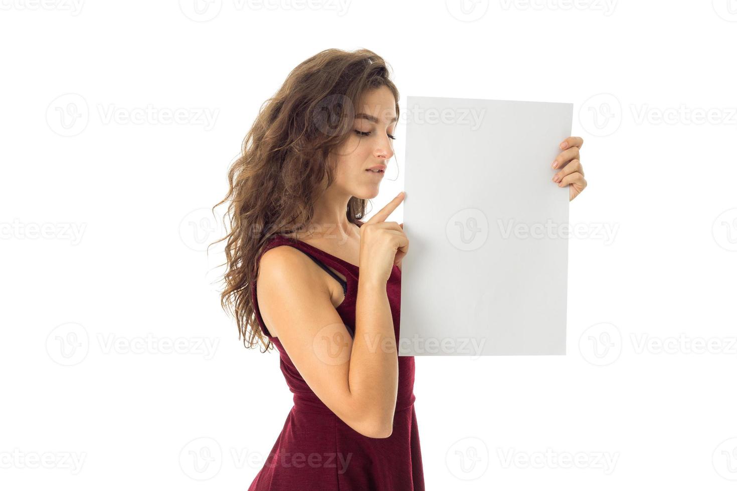 girl in red dress with white placard photo