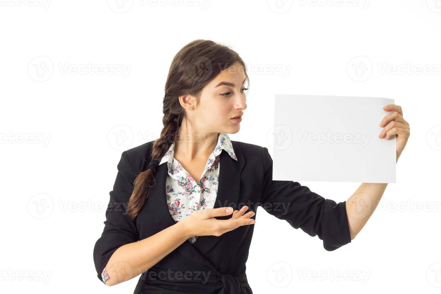 woman in uniform with white placard in hands photo