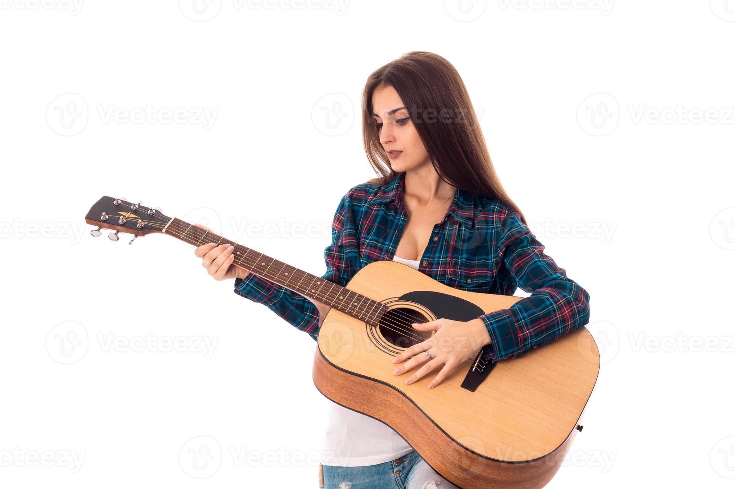 Brunette woman playing guitar photo