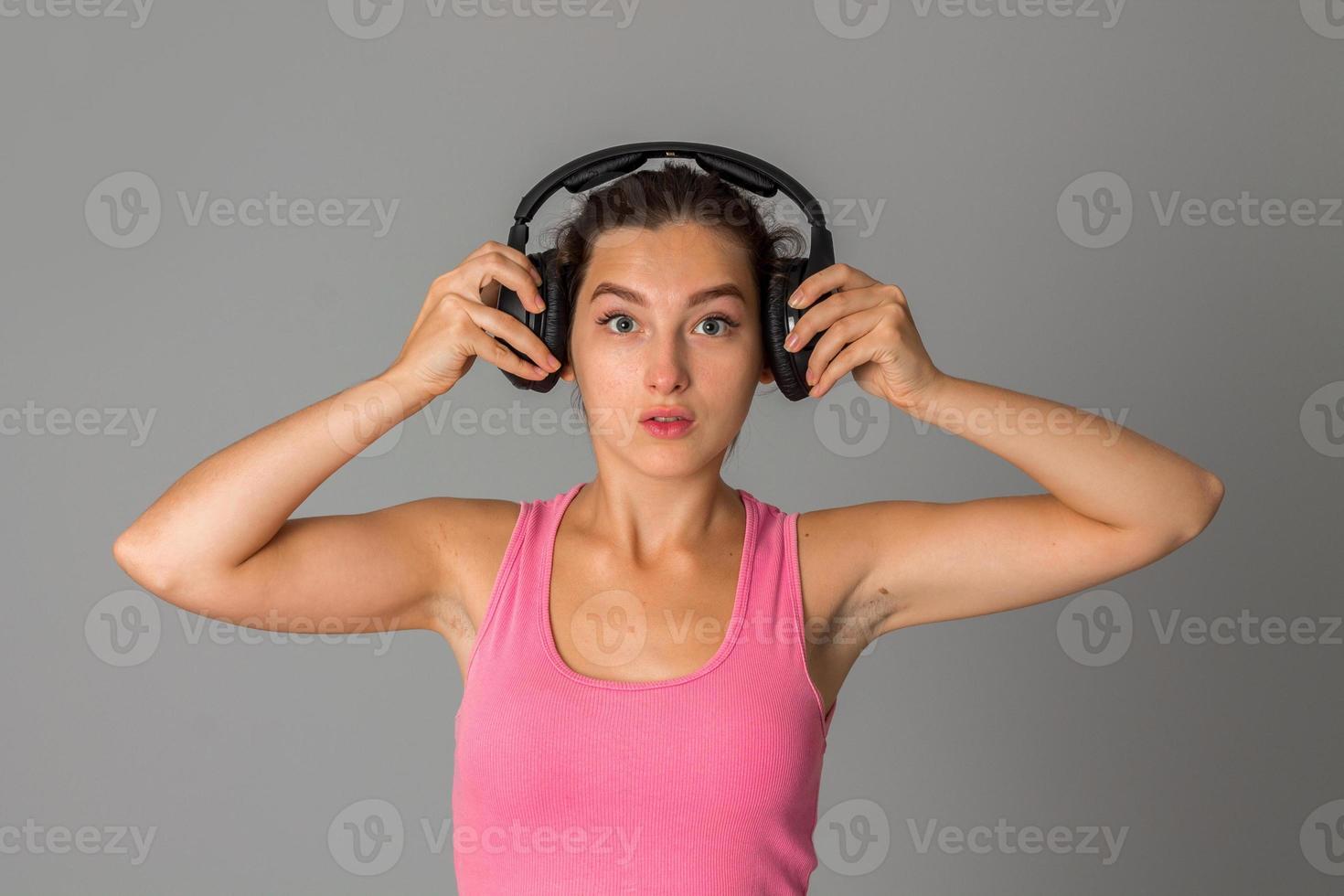 girl with headphones in studio photo