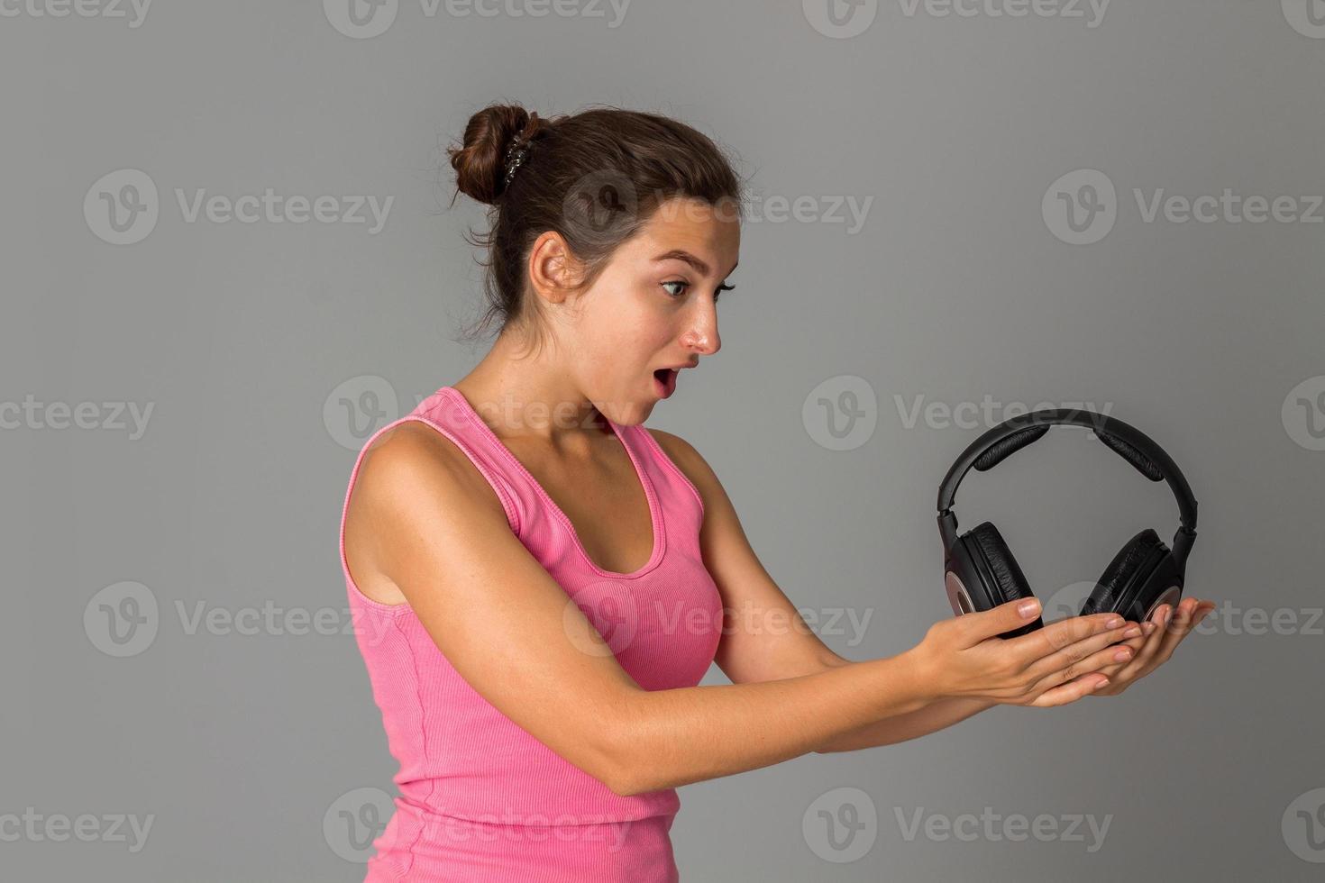 girl with headphones in studio photo