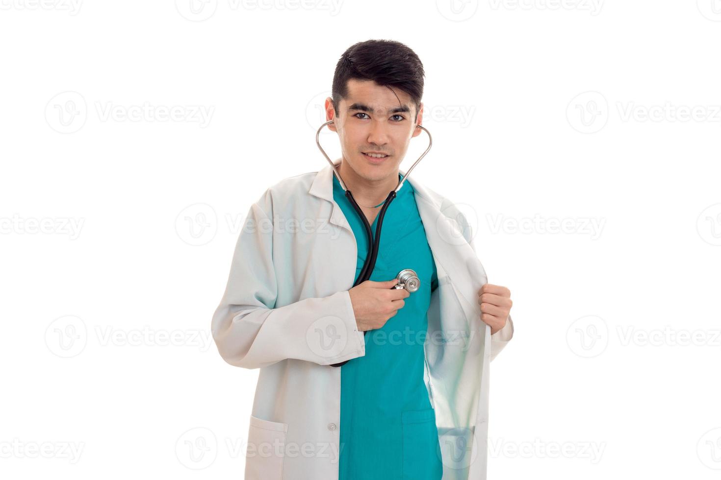 portrait of male doctor in uniform posing isolated on white background photo