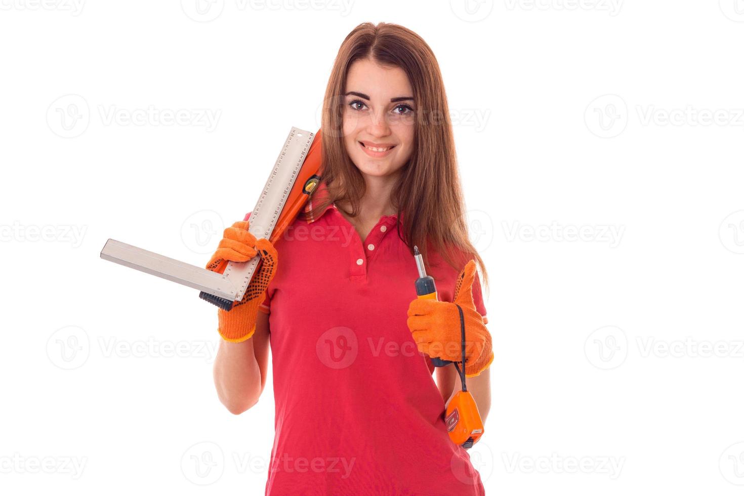 beauty brunette lady builder makes renovation isolated on white background photo