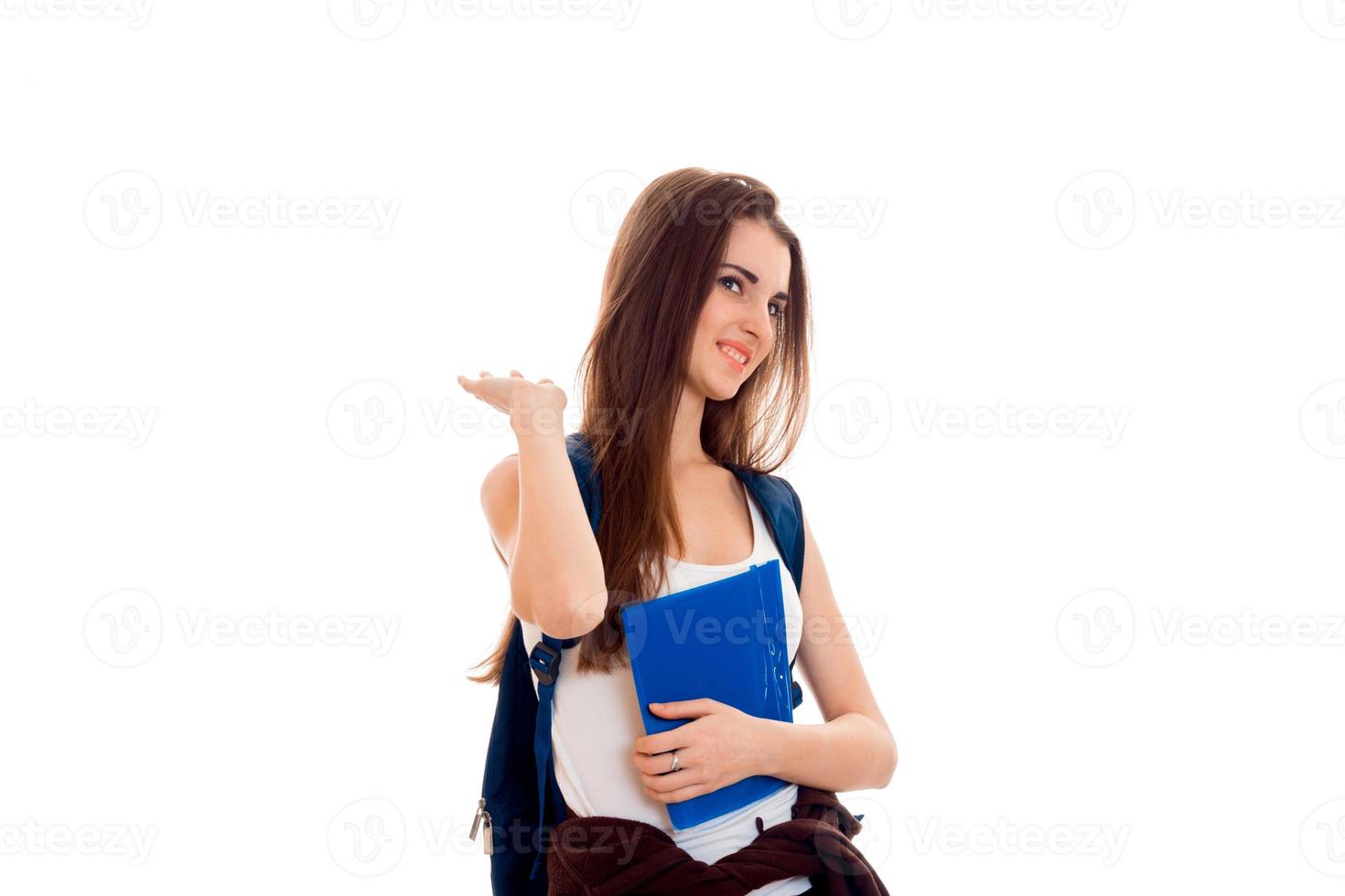 beauty young brunette student girl with backpack and folders for notebooks in hands isolated on white background photo