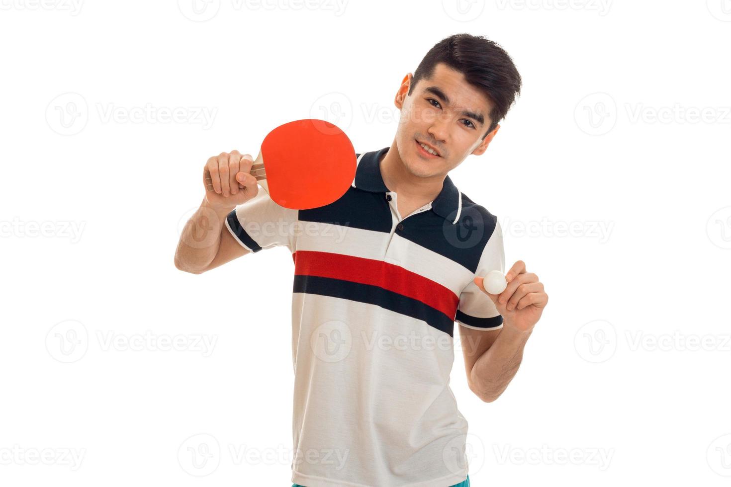 handsome young brunett man playing ping-pong isolated on white background photo