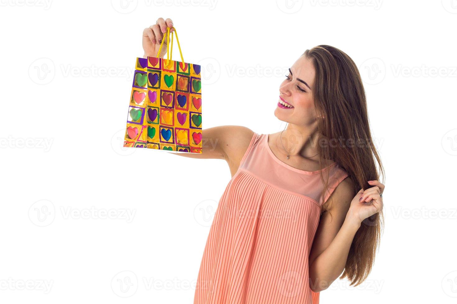 girl raised before an color package isolated on white background photo