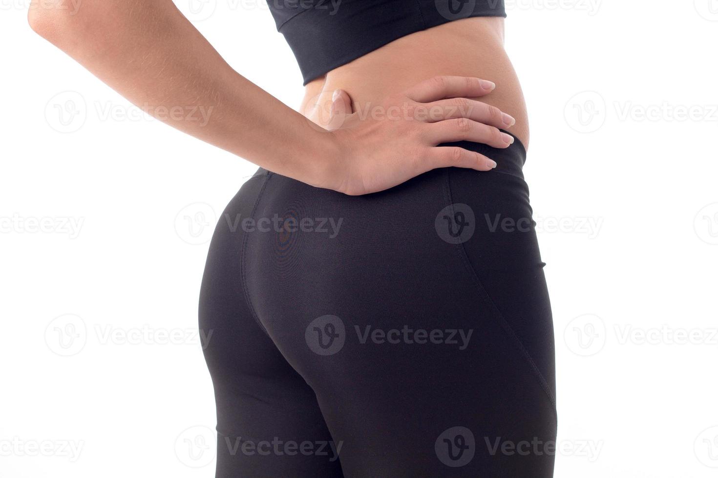 booty young sports girls in black trousers close-up photo