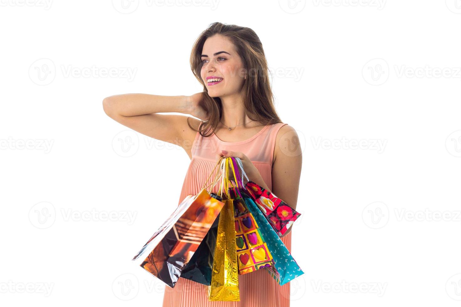 girl worth unscrewing my head to the side and holding a ranye packages isolated on white background photo