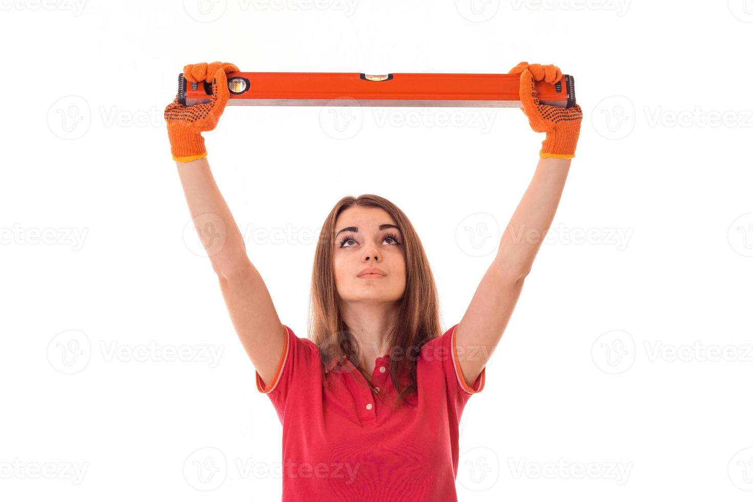 young beautiful girl raised in the hands of a repair tool photo