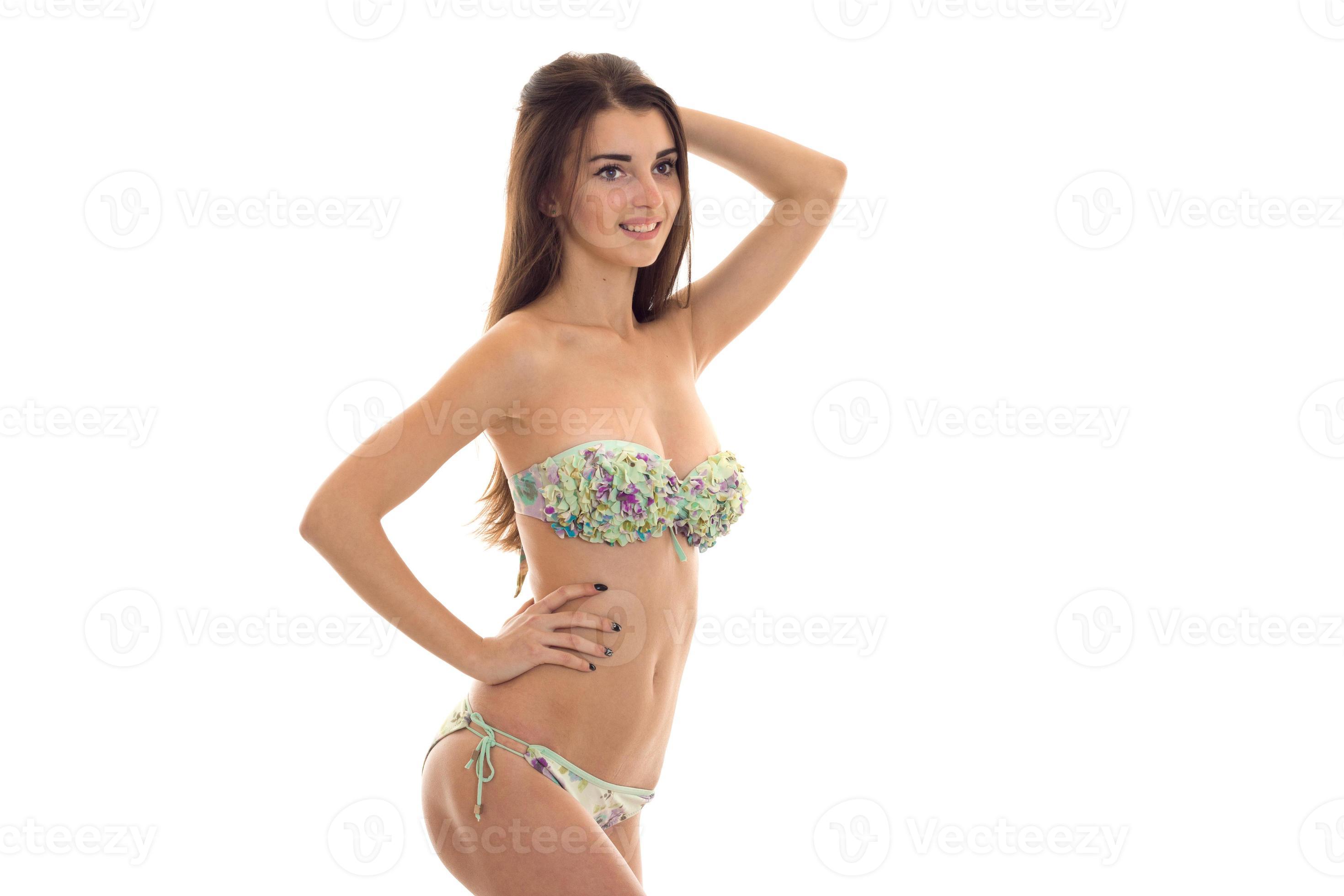 young beautiful girl in bathing suit with big breasts worth turning  sideways keeps his hand on the side and smiling 16514592 Stock Photo at  Vecteezy
