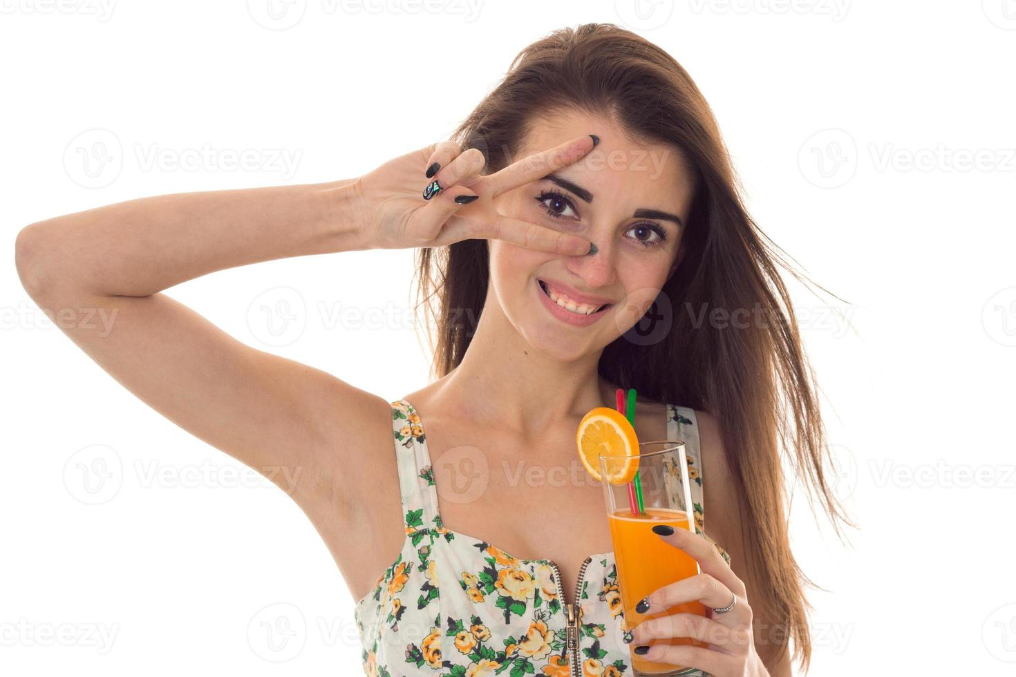 portrait of cheerful young brunette woman in sarafan with floral pattern posing isolated on white background photo