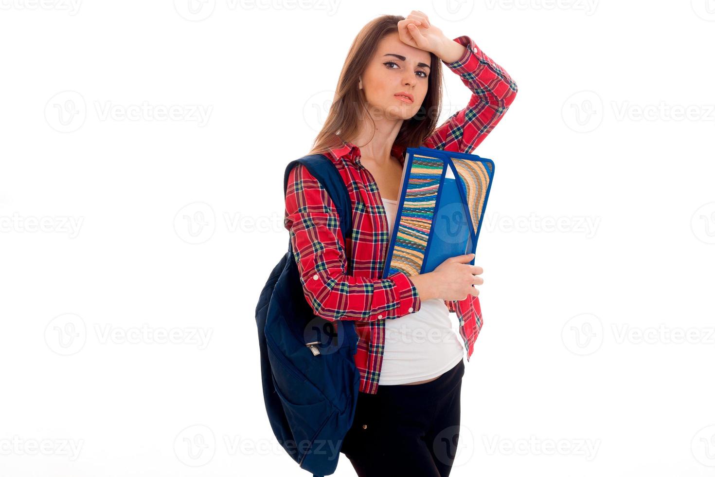 lovely young brunette students teenager in stylish clothes and backpack on her shoulders posing isolated on white background photo