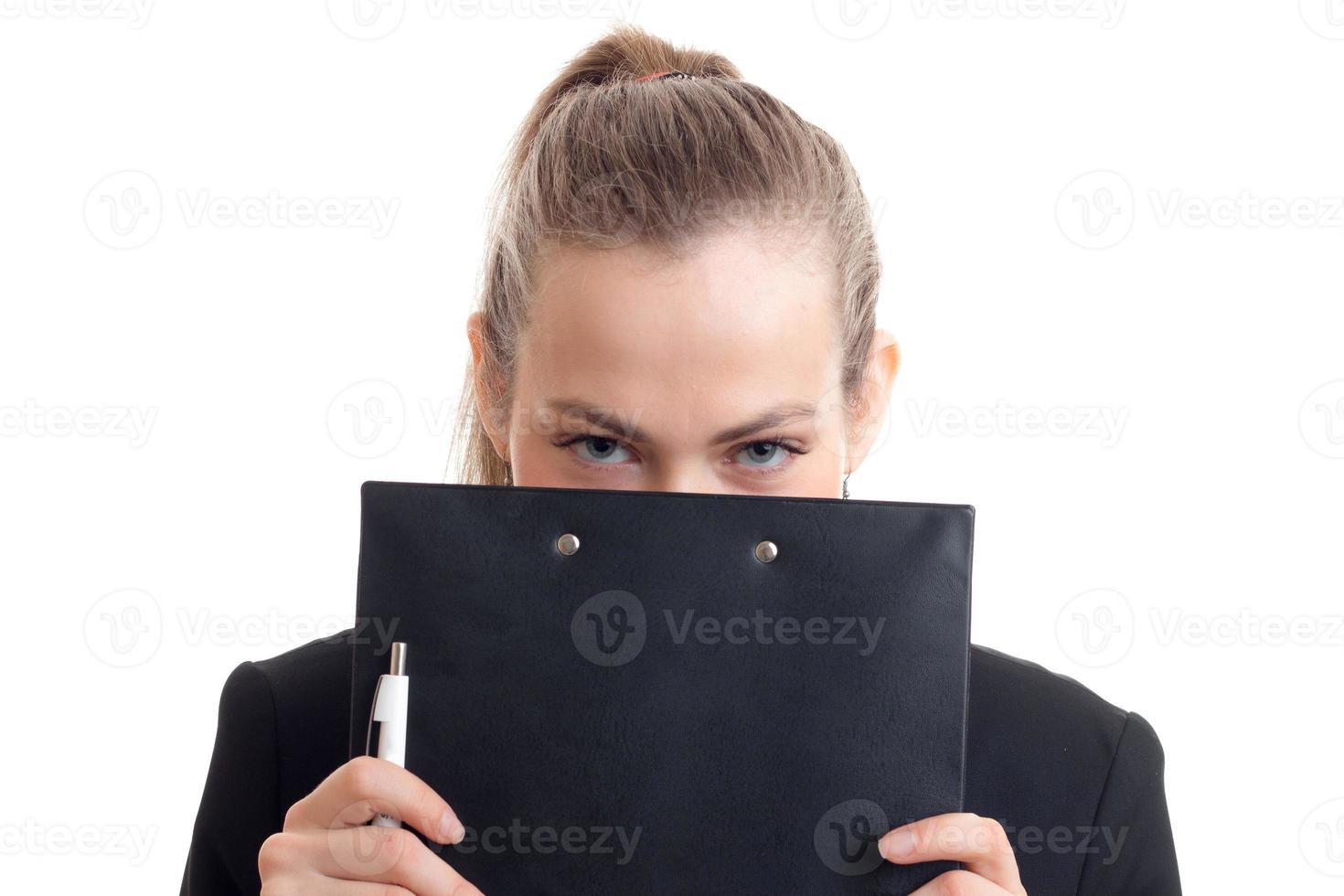 a young girl holds a black Tablet face isolated on white background photo