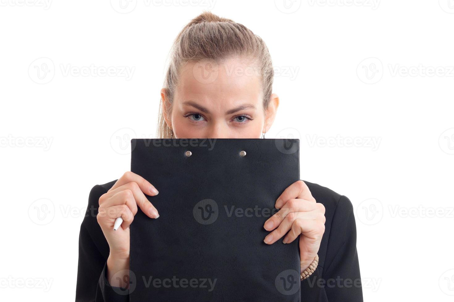 young beautiful girl covers her face and looks into the Tablet Chamber isolated on white background photo