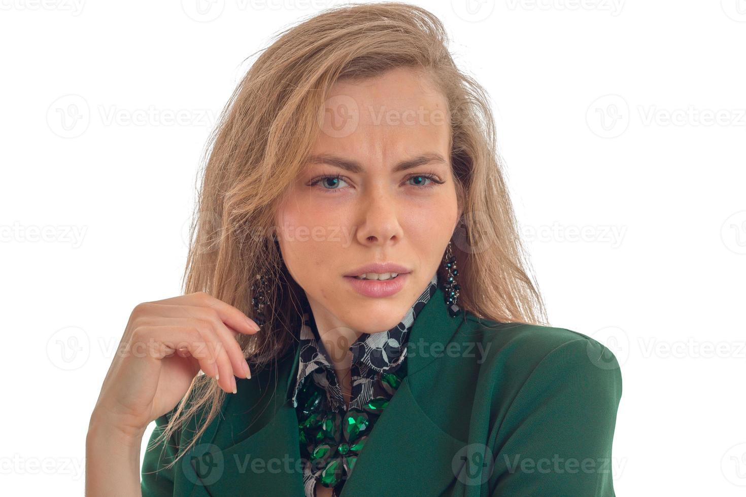 attractive young blonde surprise looks at camera isolated on a white background photo