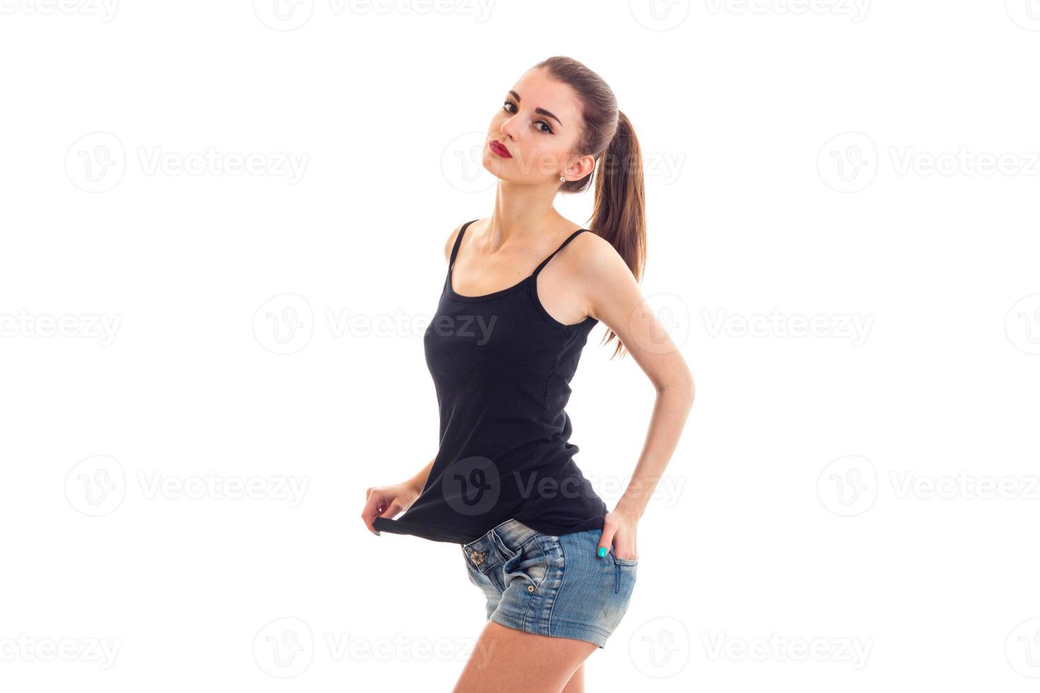 pretty young woman with red lips in casual light clothes looking at the camera photo