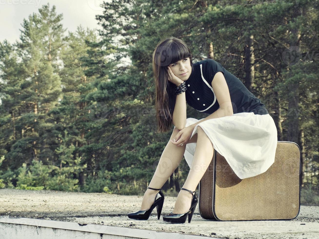 Woman with suitcase photo