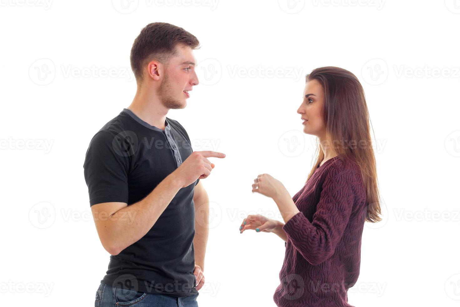 young beautiful guy and girl stand opposite each other and discover something photo