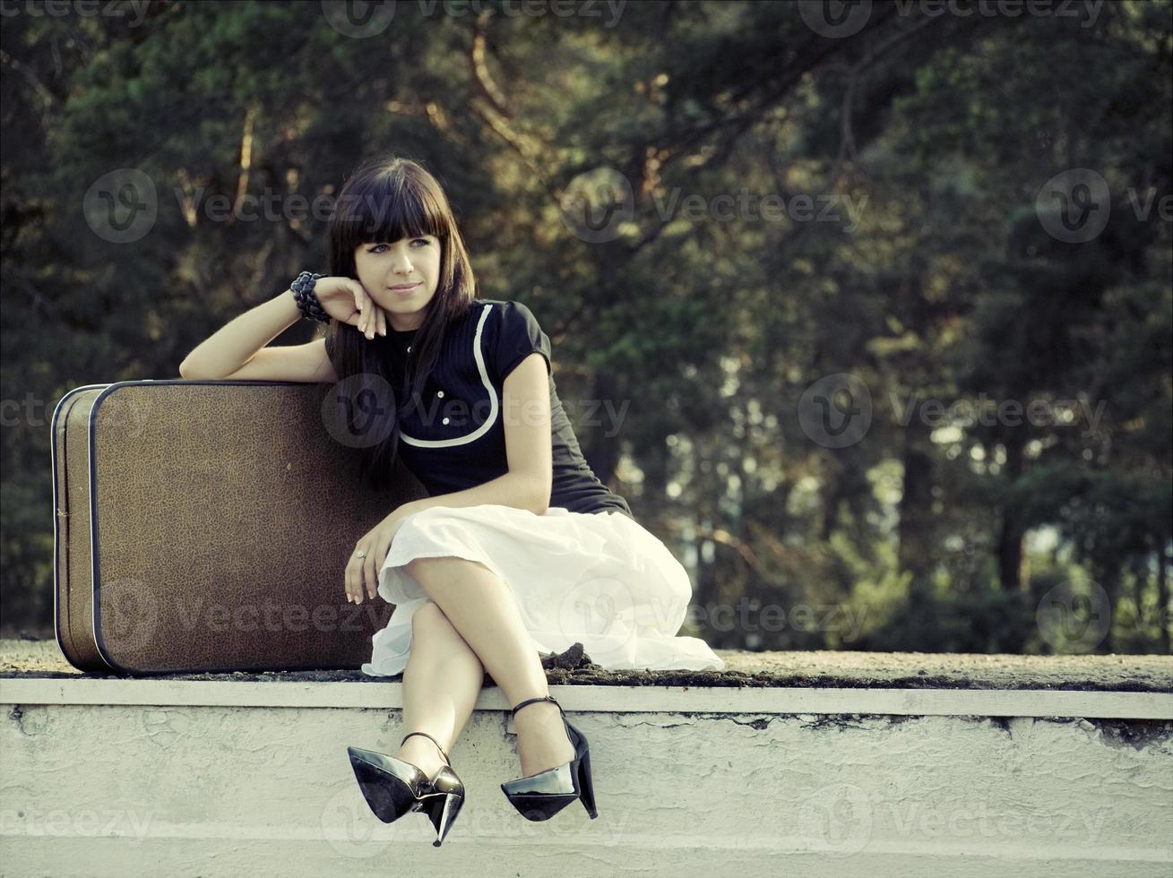 Woman with suitcase photo