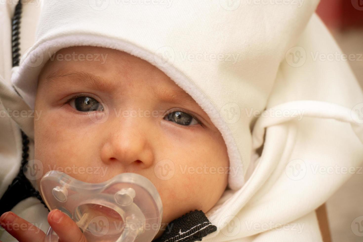 closeup portrait of serious little baby girl photo