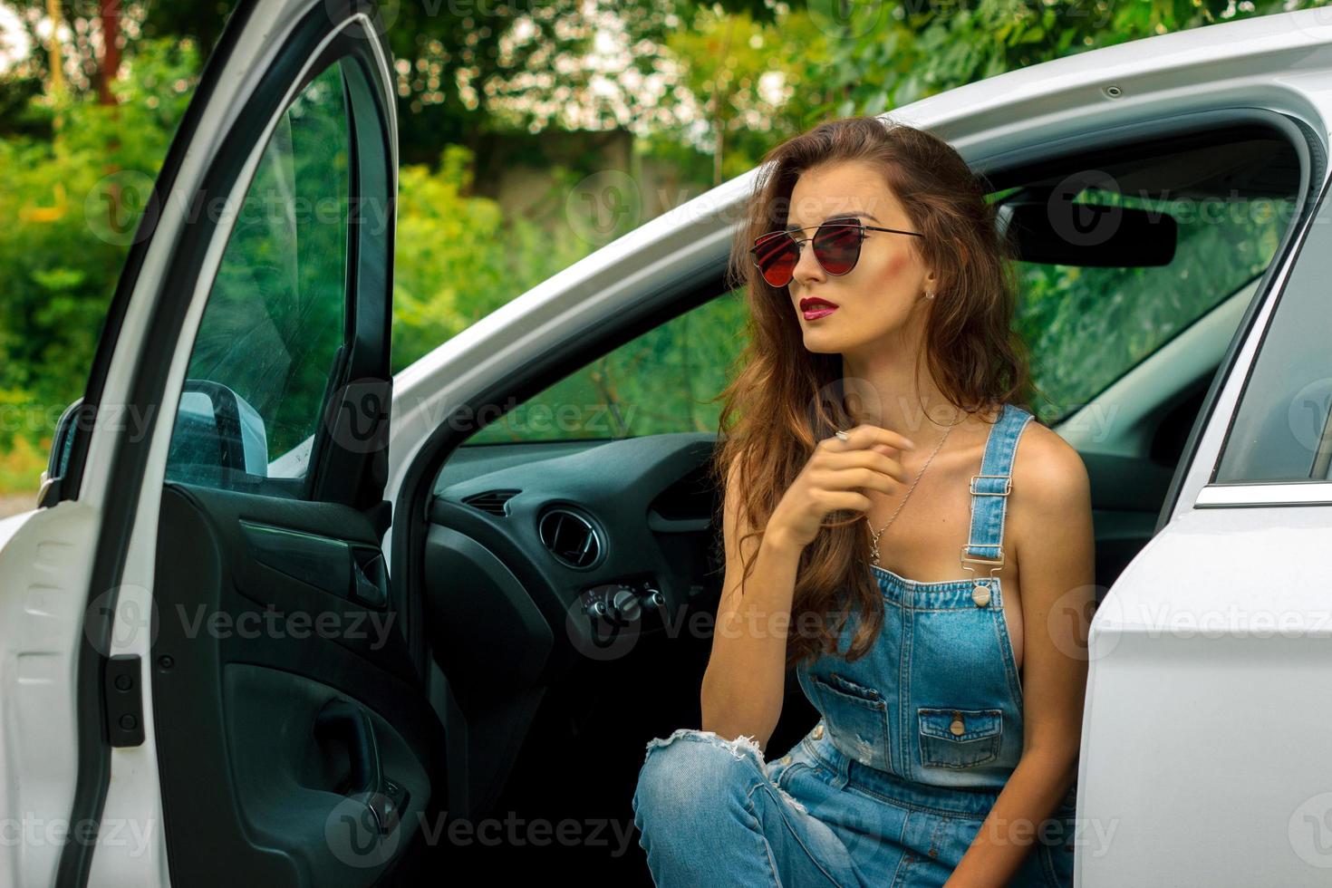 Portrait of beautiful girl in the car photo