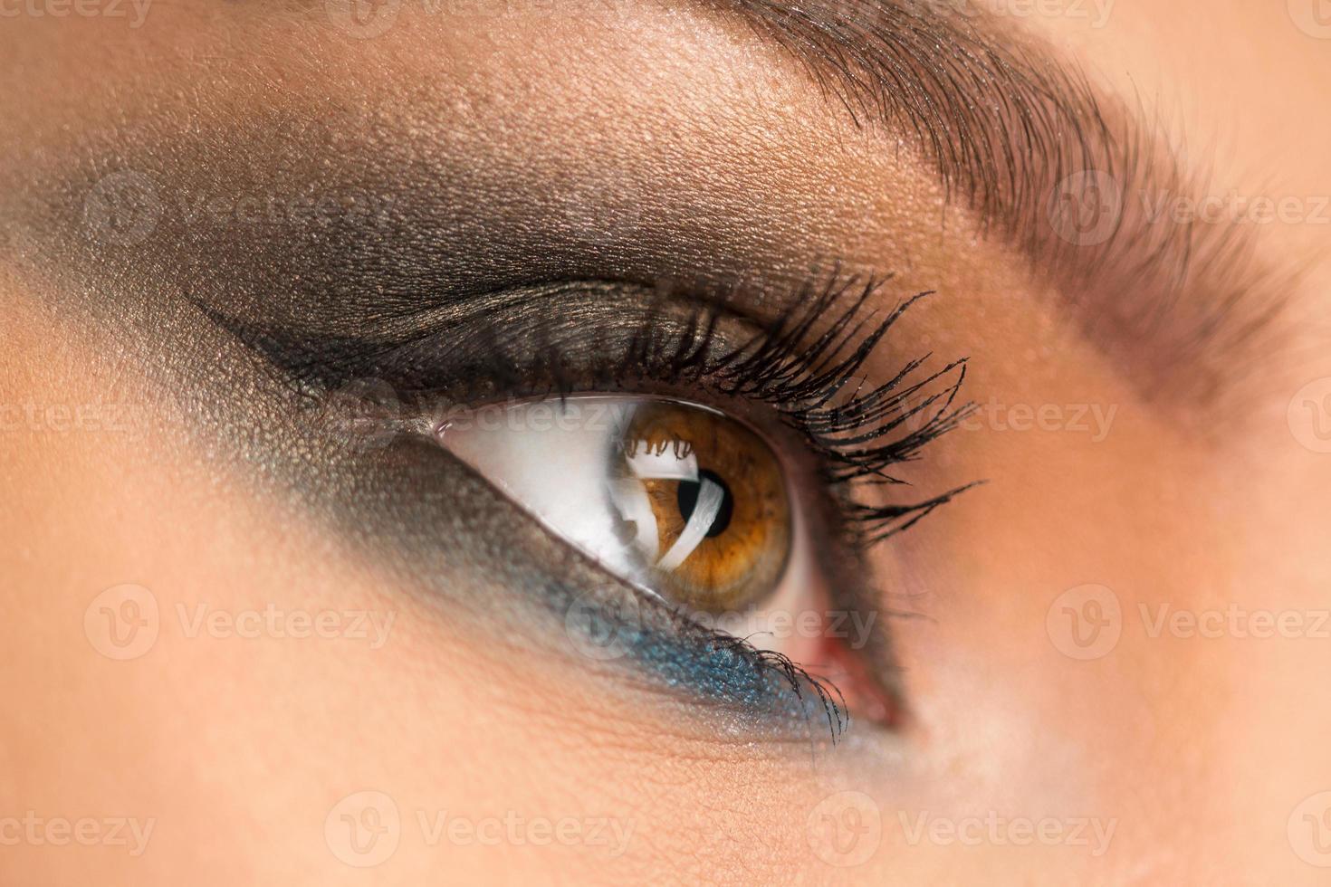 Close up of beautiful female eye with makeup photo