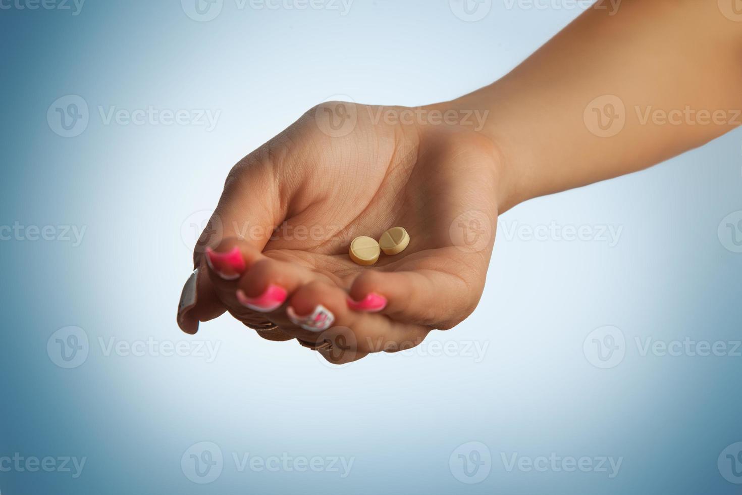 foto de estudio de pastillas en la palma