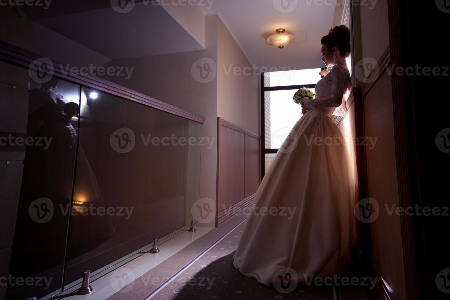 young gorgeous  bride in wedding dress photo