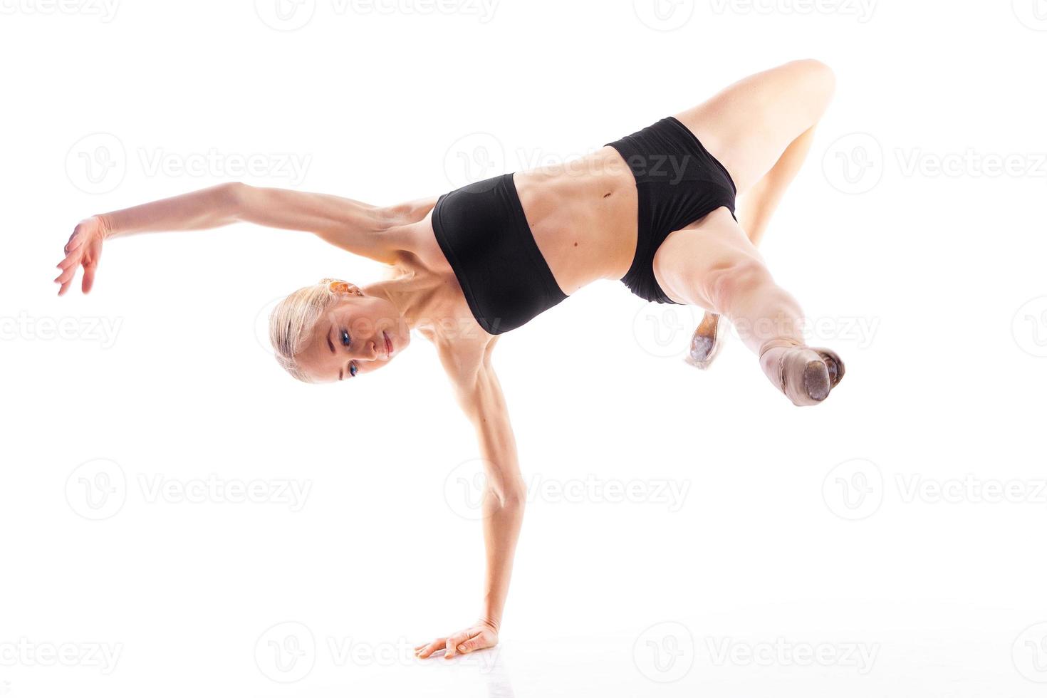 blonde ballerina posing on white background photo