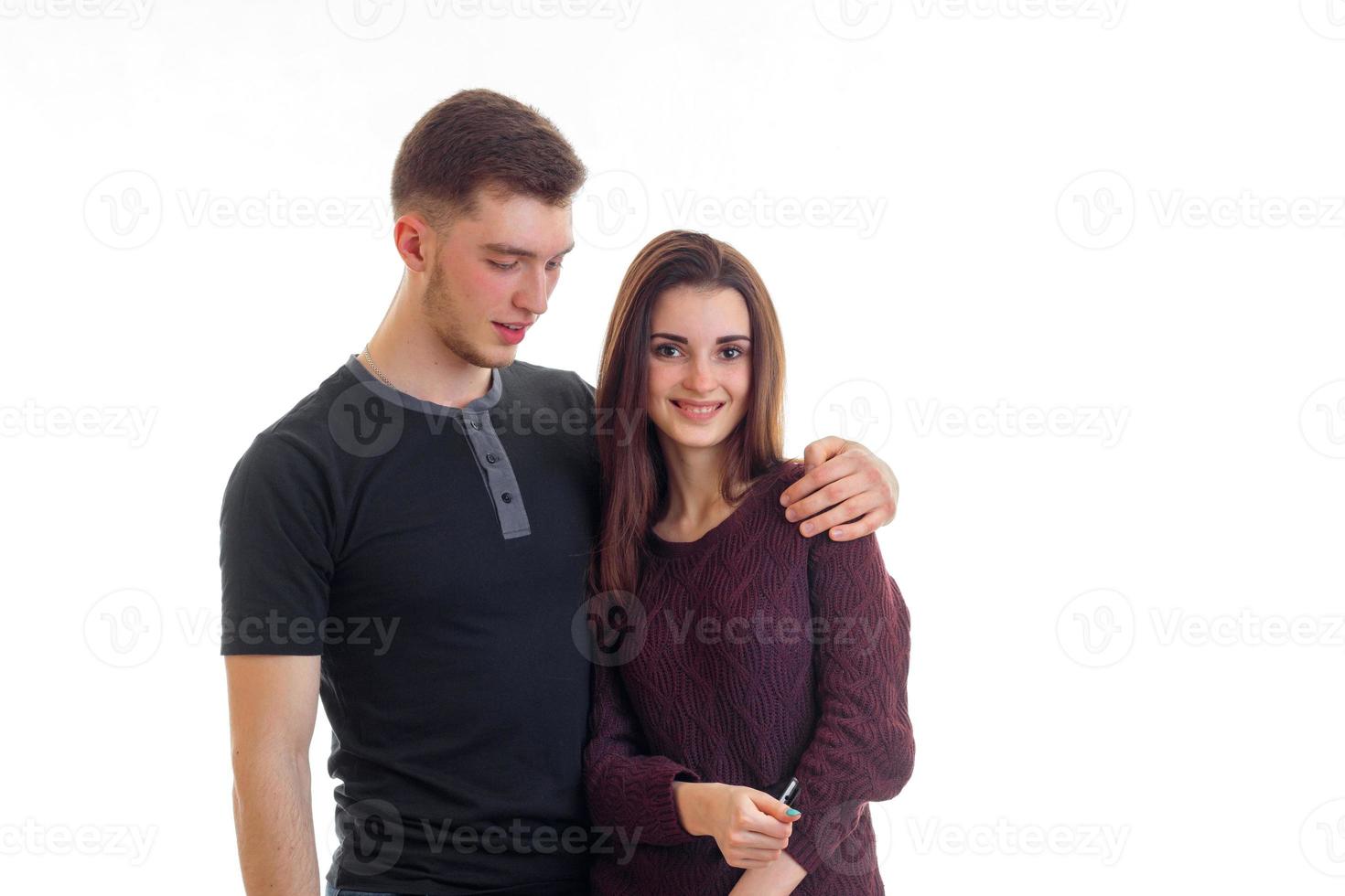 beautiful young couple smiling and posing in the Studio photo