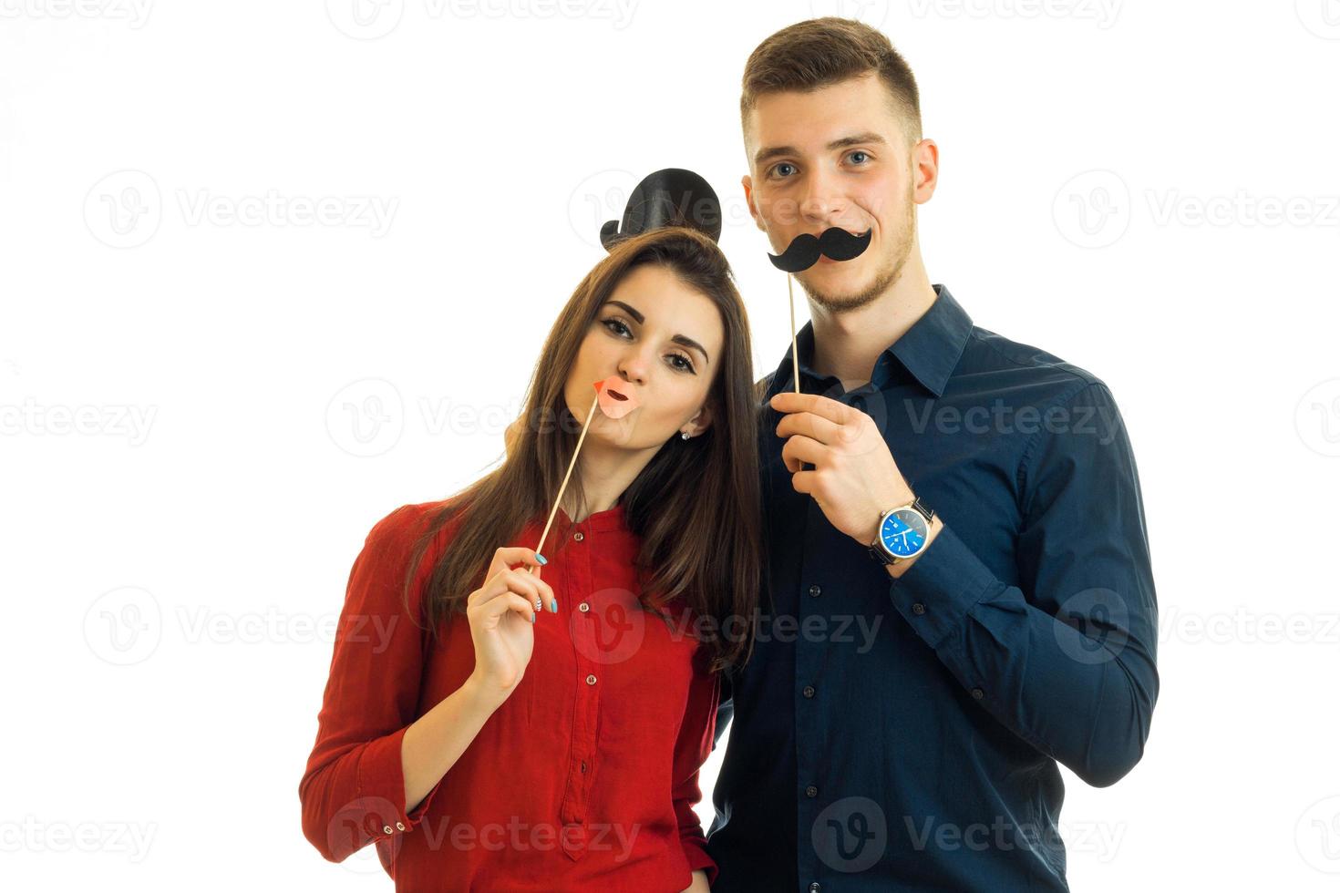 funny couple holding paper Dummies for photo and looking at camera