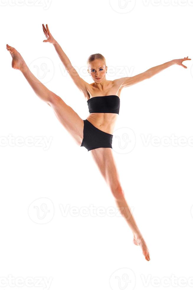 Cute ballerina isolated on white background in training suit photo